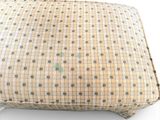 a pillow that is sitting on a white surface