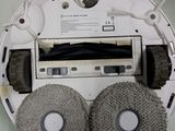a picture of a robotic vacuum cleaner with two wheels