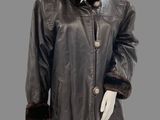 an image of a mannequin wearing a brown leather coat with a fur collar