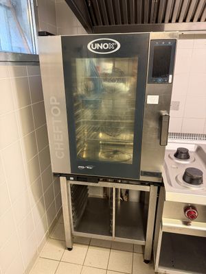 an oven that is sitting in the corner of a kitchen