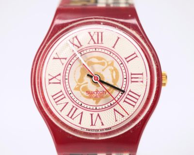 Gros plan sur une montre avec des chiffres romains