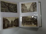 a person holding a book with pictures of buildings on it