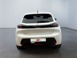 the rear end of a white car in a white room