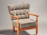 an image of a chair with a cushion and a wooden frame