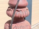a red fire hydrant that has a hose attached to it