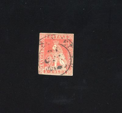the stamp is red and black with a picture of a man on it