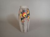 a vase with a picture of flowers painted on it