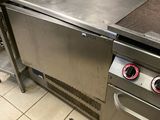 stainless steel counter top in a commercial kitchen with two burners on each side
