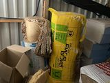 a pile of boxes and other items in a room