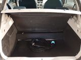 a car trunk with a bunch of wires in it