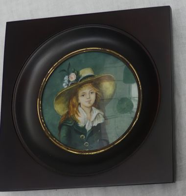 a picture of a picture of a girl in a hat on the wall
