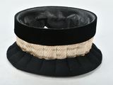 a black hat with a gold band on it