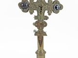 an image of a cross on a pedestal on a white background