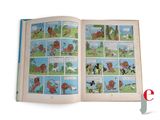 an open book with pictures of dogs and cats on it