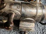 a close up of a metal object on a carpet