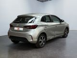 the rear end of a silver car parked in a room