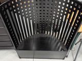 a black plastic chair that is sitting on the floor