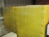 a large yellow box sitting on top of a pallet in a warehouse
