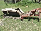 an old rusted out lawn mower in the grass