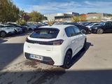 the rear of a white car parked in a parking lot