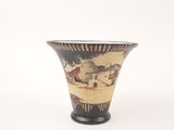 a black and white vase with a painting on it