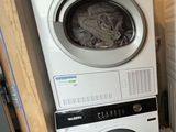 a washer and a dryer in a small room