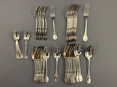 a lot of silver spoons and forks on the table