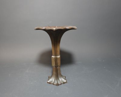 an image of a small table with a flower design on the top