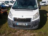 a white van that is parked in the grass