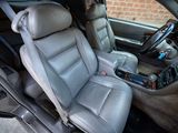 the interior of a car with the front seats down and a radio in the passenger seat