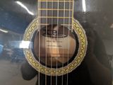 someone is holding a guitar with a picture of a man ' s face in the middle of it