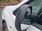 a car that has a side view mirror on the side of it