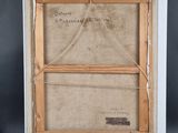 an old picture frame with a piece of fabric hanging from it ' s sides