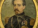 portrait of a man in a military uniform with a pipe in his mouth