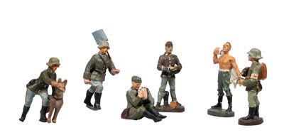 figurines of a group of soldiers with a dog on a white background