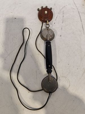 a telephone that is connected to a cord on a table
