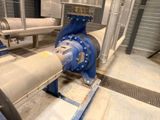 a blue pipe and a blue valve in a room