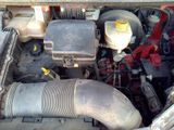 a picture of a car engine with its hood open