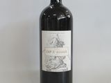 the bottle of red wine is sitting on the table