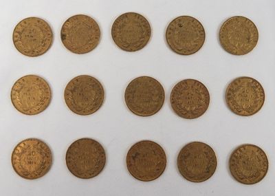 several different types of coins are arranged on a white surface