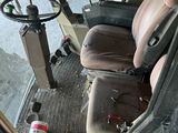 an image of a bus with a driver seat and steering wheel