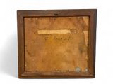 an old wooden picture frame with a picture of a man on it