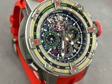 a close up of a watch with a red band