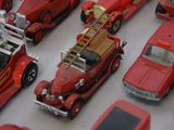 many toy cars that are sitting on a table
