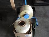 two rolls of yarn sitting in a box on the floor