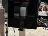 an image of a tv on a stand in a warehouse