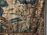 an image of a tapestry hanging on a wall in a room