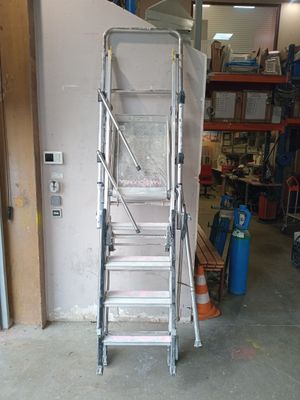 a ladder that is standing in a garage