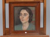 painting of a woman in a green dress in a wooden frame