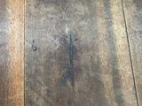 a close up view of a wooden floor with scratches on it